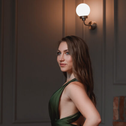 Portrait of soprano Annija Adamsone in a green dress