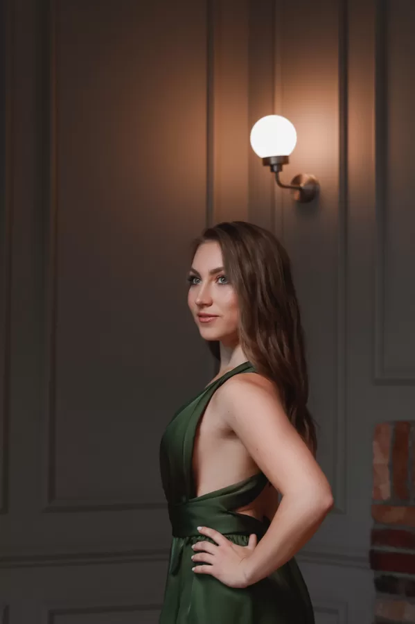 Portrait of soprano Annija Adamsone in a green dress